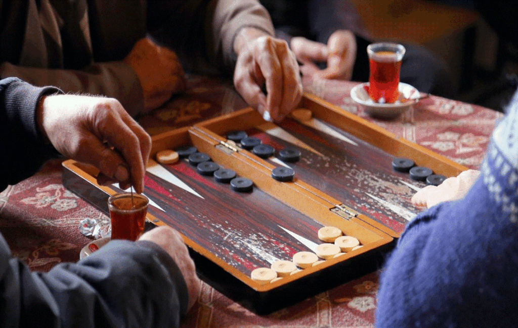 Playing Backgammon Tavli At The Local Traditional Cyprus Coffee Shop Kafeneio