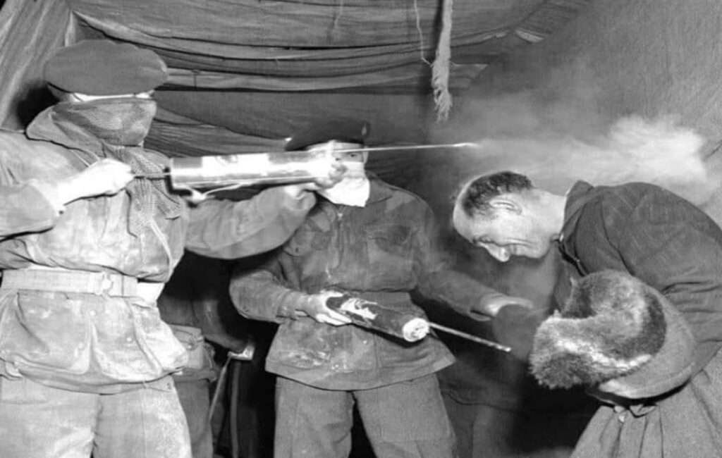 A British Soldier Fumigating A New Arrival